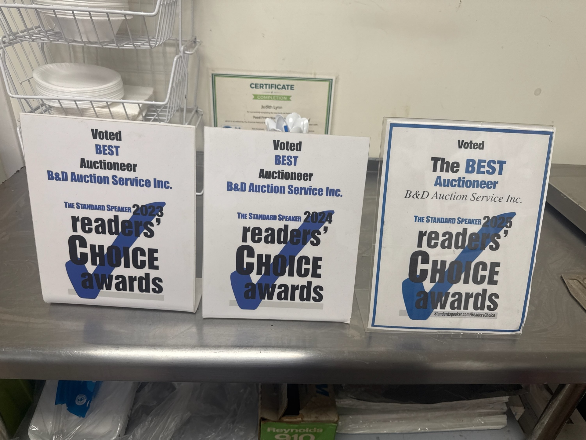B&D Auction Service Inc. Readers' Choice Award plaques from The Standard Speaker for 2023, 2024, and 2025 — Voted Best Auctioneer